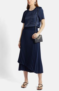 An elastic waist tops this flowy midi-length skirt accented with a layered design, asymmetric hem and easy-moving pleats. Elastic waist 100% polyester Dry clean Imported Navy Midi Skirt, Navy Blazer, Midi Length Skirts, Pleated Midi Skirt, Asymmetric Hem, Layers Design, Midi Length, Pleated Skirt, Elastic Waist