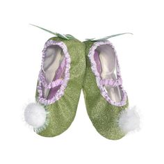 pair of green slippers with white pom - poms