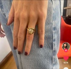 a woman's hand with a gold ring on it and two other pictures in the background