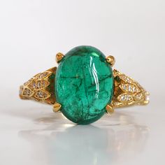 Read about our payment plans before proceeding.This is what dreams are made of. This emerald ring features an insanely gorgeous deep green natural cabochon emerald stone, embellished with 57 natural white diamonds with details like phoenix wings. A classy and sleek ring to treasure forever. Handcrafted in your choice of 14K yellow gold, rose gold, and white gold. The emerald shown is the exact same emerald you will receive. 14K solid gold Natural 12*9mm natural cabochon emerald. Approx. 2.8ct~. Phoenix Wings, Fall Rings, Hall Of Mirrors, Oval Diamond Ring, Emerald Diamond Ring, Baguette Diamonds, Crystal Diamond, Natural Rock, Emerald Stone