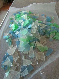 a pile of broken glass sitting on top of a table