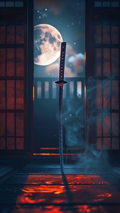 a large knife sitting on top of a floor next to an open door with the moon in the background