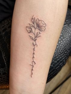 Forearm tattoo. Black ink. Dainty lines. Sweet Pea flowers where the stem spells “sweetpea.” Sweetpea Flower Tattoo, Sweat Pea Tattoo, Tattoos About Healing, Resilience Tattoo, Dainty Tattoo, Flower Spine Tattoos, Simple Tattoos For Women