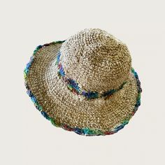 Hemp Crochet Sun Hat - Rainbow Our 100% handmade crocheted sun hats are made from pure hemp yarn from Nepal. Perfect for summer...at the beach, pool, festival or just hanging around. They come in one size which fits most! As with many 100% hemp products they maybe slightly stiff, but soften and stretch over time. Features: 100% Hemp hat and handmade in Nepal It has wire in the rim means you can shape the hat however you desire and flat pack it for easy storage or travel. One size which fit most Bohemian Lightweight Brimmed Hat, Bohemian Brimmed Lightweight Hat, Adjustable Woven Crochet Hat For Festivals, Artisan Hat For Summer Beach, Adjustable Multicolor Crochet Straw Hat, Adjustable Multicolor Straw Crochet Hat, Natural Bohemian Brimmed Hat, Spring Bohemian Crochet Hat, Bohemian Lightweight Brimmed Sun Hat