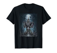 a black t - shirt with an image of a man standing in the middle of a forest