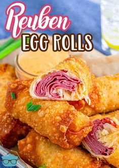 an egg roll is stacked on top of another roll, with the words reuben egg rolls above it