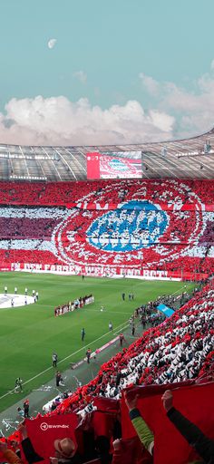 a stadium filled with lots of red and white fans