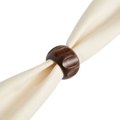 a close up of a white and brown tie