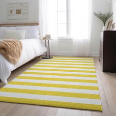 a white and yellow striped rug in a bedroom