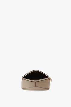 The B Frame Mini Wash Bag in elegant Ivory is an elevated everyday essential. Meticulously made in Italy from tactile leather and lined in hard-wearing canvas, it features the house’s signature V-shaped panels and B-engraved zip puller. A Victoria Beckham stamp and serial number add a subtle design detail. Victoria Beckham Victoria Mini Travel Pouch In Ivory Leather  - Size ONE SIZE UK Luxury Textured Leather Everyday Pouch, Luxury Textured Leather Pouch Bag, Luxury Rectangular Pouch With Gold-tone Hardware, Luxury Pouch Bag With Gold-tone Hardware, Luxury Leather-lined Everyday Pouch, Victoria Beckham Bags, Zip Puller, S Signature, Wash Bags