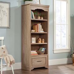 Add a touch of timeless beauty and charming style to your home with this bookcase with drawer from the Rollingwood™ collection. This bookcase with storage features three adjustable, spacious shelves that are ideal for storing and displaying anything you need – from collectibles and prized possessions to knick-knacks and decorative plants. Create flexible storage options in your office with your display bookcase that will hold items of all different shapes and sizes from awards to textbooks, manuals to schedules. This 4-shelf bookcase features a lower file drawer with full extension slides to hold your most important letter or legal-size hanging files. Or use the drawer for general storage if you don’t have a need to house hanging files. Finished in Brushed Oak™, this office bookcase offers Bookcase With Storage, Bookcase With Drawers, 4 Shelf Bookcase, Display Bookcase, Decorative Plants, Office Bookcase, File Drawer, Hanging Files, Home Office Space