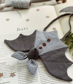 a bat decoration sitting on top of an open book