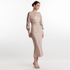 The elegant beige Lily backless dress exudes bold and elegant charm.  It is made of a mixture of silk and viscose with a satin appearance. The dress has long lilac sleeves, a boat neckline and a bare back for a sensual but also refined look 60% silk 40% viscose dry clean Luxury Beige Silk Midi Dress, Elegant Beige Silk Midi Dress, Luxury Beige Bias Cut Dress, Luxury Beige Viscose Midi Dress, Luxury Beige Midi Dress With V-neck, Beige Midi Dress, August Birthstone Jewelry, July Birthstone Jewelry, Gifts For New Mums