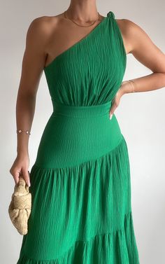 Make a statement in our Celestia Midi Dress - Tiered One Shoulder Dress In Green. This vibrant green dress is perfect for any occasion, from casual weekend activities to special events. The A-line silhouette and tiered detailing create a flattering and feminine look, while the one-shoulder design adds an element of elegance. Made from high-quality rayon fabric, this dress is both comfortable and durable. With its midi length and sleeveless style, it's the ideal piece for warm weather days or can be layered with a jacket for cooler evenings. Embrace your unique style with confidence in our Celestia Midi Dress - the perfect addition to your wardrobe!Product Details:A-line dress silhouetteOff the shoulder necklineMidi lengthSleeveless designMade with rayon fabricCasual and weekend activity we Weather Day, Dress Silhouette, Feminine Look, Midi Length, Warm Weather, Green Dress, Off The Shoulder, One Shoulder Dress, A Line Dress