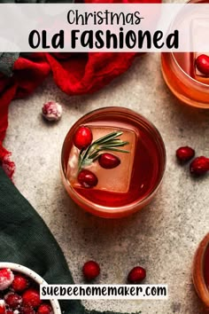 an old fashioned drink with cranberries and rosemary garnish