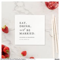 the eat, drink and be married card is next to strawberries on a marble surface