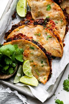 mexican flatbreads with lime and cilantro on a tray