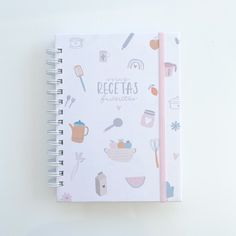 a notebook with the words recetas written on it and various kitchen utensils