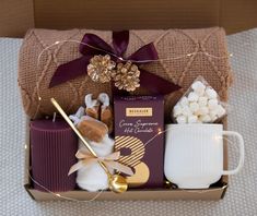 a gift box filled with chocolates, marshmallows and coffee