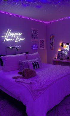 a bedroom with purple lighting and a bed in the middle that has a teddy bear on it