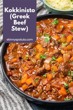 a bowl filled with beef stew next to mashed potatoes and parsley on the side