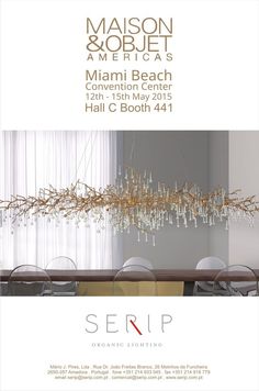 an advertisement for the miami beach convention center featuring chairs and chandelier with gold accents