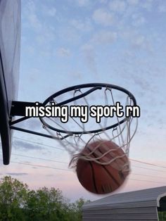 a basketball going through the hoop that says missing my sport'm on it,