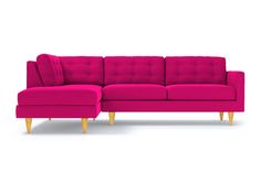 a pink couch sitting on top of a white floor