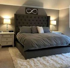 a bedroom with a large bed and two nightstands