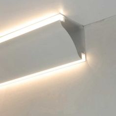 a white wall with two lights on it