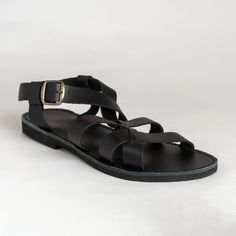 Timeless and classic, Greek leather sandals for men offer both comfort and durability. Handmade with high-quality leather from Crete, they are a must-have for any fashion-conscious man. Suitable for any occasion, their simple yet elegant design complements both casual and formal attire. Natural irregularities in color and texture add to their charm. SIZE GUIDE All genuine leather sandals can be stiff at the begging and widen after few days of wearing them.  If you wear a half size, choose the ne Leather Footbed T-strap Sandals With Single Toe Strap, Synthetic T-strap Sandals With Leather Footbed And Open Toe, Black Leather T-strap Sandals With Leather Footbed, Leather Sandals For Men, Black T-strap Sandals With Leather Sole, Conscious Man, Black Leather T-strap Sandals With Buckle Closure, Genuine Leather Sandals, Mens Shoes Sandals