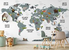 a children's room with a map of the world wallpapered on it