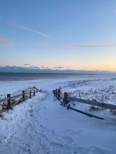 the beach is covered in snow and there are no people on it or any other