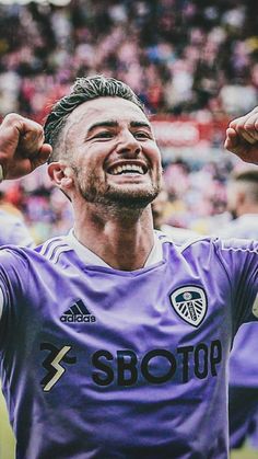 a soccer player is celebrating his team's win over the other team in a game