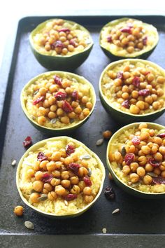 several bowls filled with food sitting on top of a pan