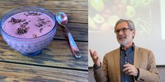 a man standing next to a bowl of food and a spoon in front of him