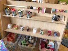 the shelves are filled with craft supplies for kids to use in their crafts and crafts