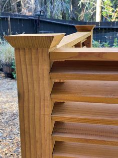 a close up of a wooden fence with slats on the top and bottom part