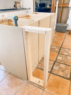 an unfinished kitchen cabinet in the process of being built