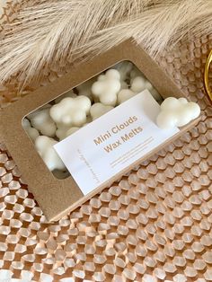 mini clouds wax melts in a box on a table