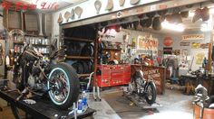 a garage filled with lots of different types of motorcycles and tools in it's storage area