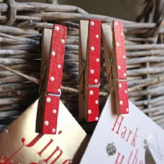 two red and white tags hanging from a basket