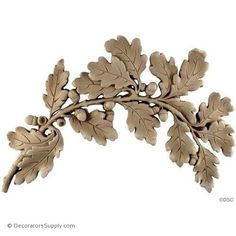 an oak leaf and acorn decoration on a white background