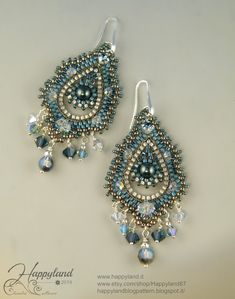 two pairs of beaded earrings with blue and white beads hanging from the ends of them