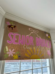 a window with the words senior brunch painted on it