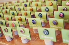 there are many different types of badges on the table together in order to display them