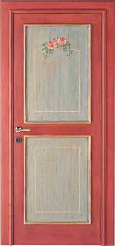 a red door with two glass panels and flowers painted on it