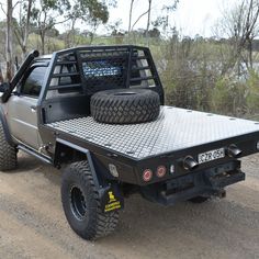 a truck with two tires on the bed