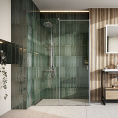 a bathroom with a walk in shower next to a sink and a mirror on the wall