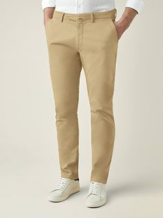 Elevate your spring-summer wardrobe with our cotton chinos, crafted in Northern Italy from lightweight and durable whipcord cotton. This breathable fabric is blended with 3% elastane for added stretch ensuring a more comfortable and easier fit.    Our chinos feature a mid-rise and slightly tapered fit, designed to provide a refined and sophisticated look. With a focus on practicality, this piece is tailored with four convenient pockets and bespoke details such as a concealed triple button closur Everyday Chinos With Tapered Leg In Chino Cotton Twill, Everyday Chinos With Tapered Leg, Everyday Tapered Leg Chinos, Spring Cotton Stretch Chinos, Spring Stretch Cotton Chinos, Everyday Chino Cotton Twill Trousers, Beige Relaxed Fit Chinos In Cotton Twill, Stretch Cotton Chinos With Welt Pockets, Spring Cotton Chinos With Straight Fit